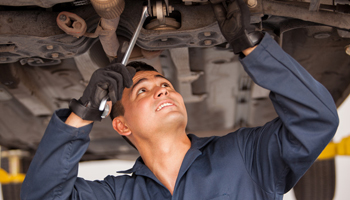 mechanic-underneath-car-fixing